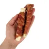 Faunakram expanded rawhide wrap råhudspinde med andewrap vist i hånden