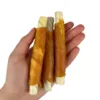 filled-white-rawhide-roll-chicken-paste-faunakram i hånden